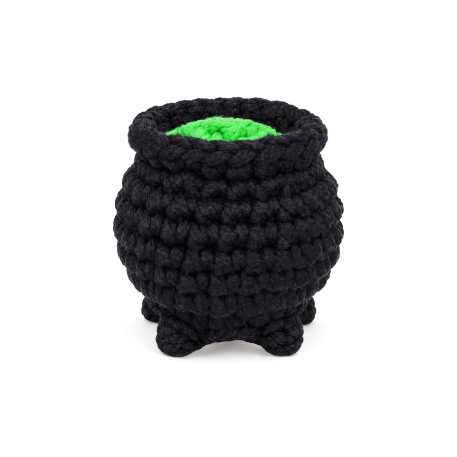 Black crochet cauldron with a green brew inside