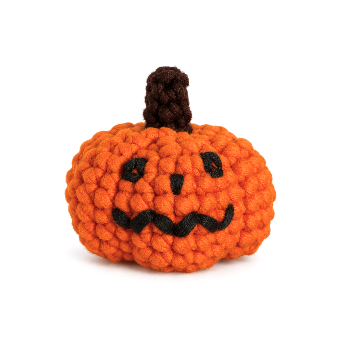Orange crochet jack-o-lantern with an embroidered face