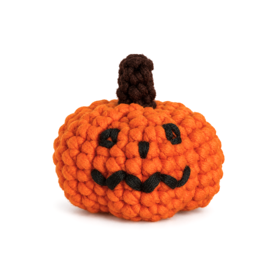 Orange crochet jack-o-lantern with an embroidered face