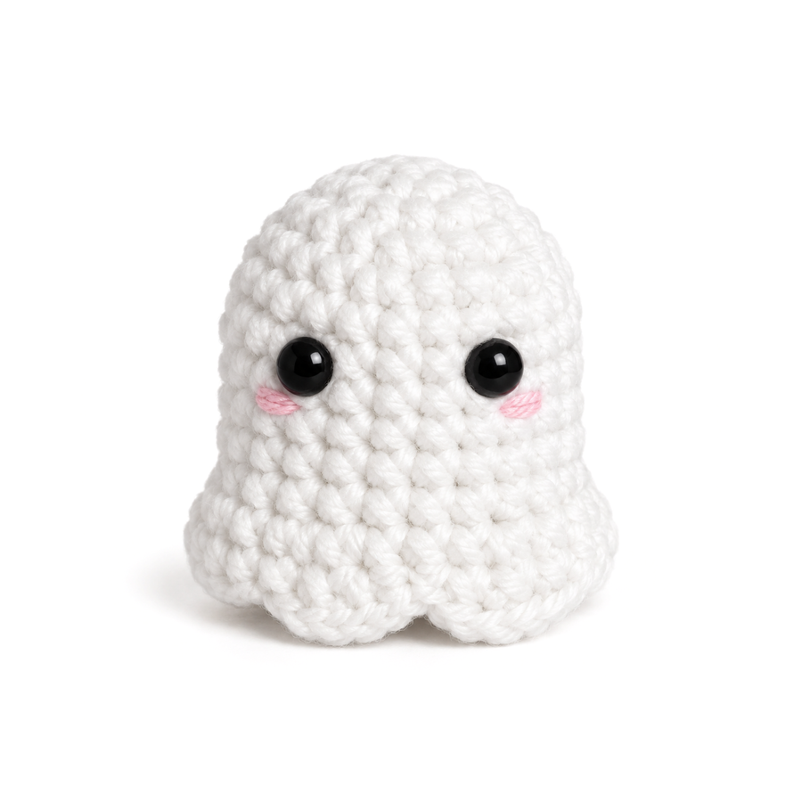 White crochet ghost with black eyes and pink cheeks
